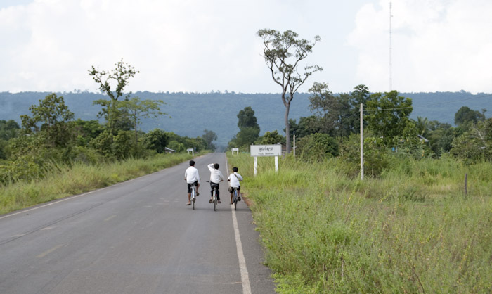 trio of children on bicycles