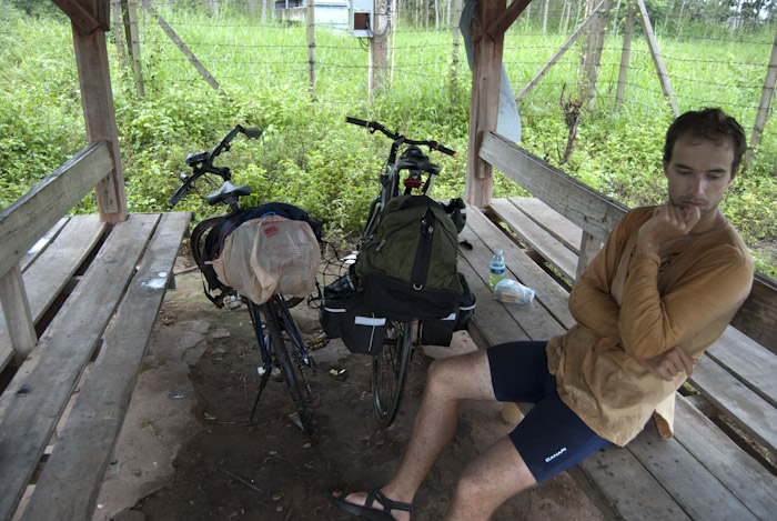 Micah in bus stop with bikes